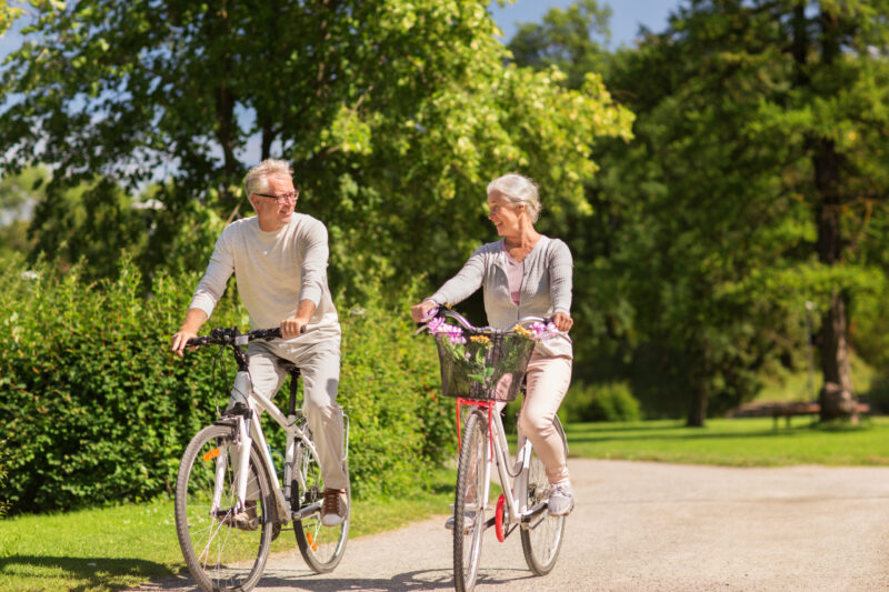 older senior couple cycling