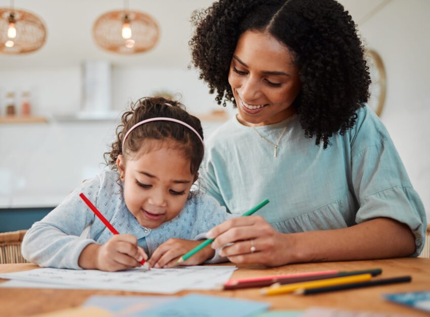 Mother colouring in with her daughter